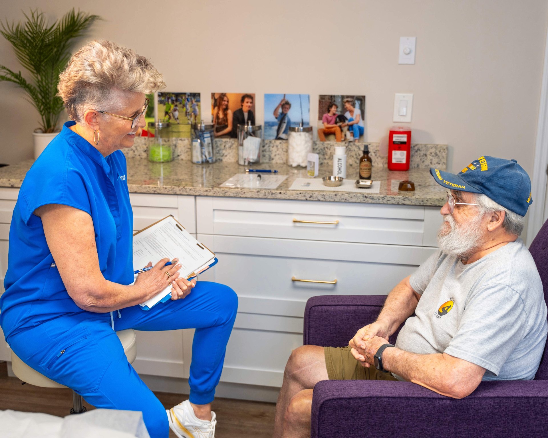 Dr. Kim Windschauer, AP consulting with a U.S. veteran at Acupuncture of West Florida in Clearwater.